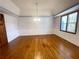 Formal dining room with hardwood floors and wainscoting at 10995 Parsons Rd, Johns Creek, GA 30097