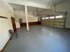 Attached garage with epoxy flooring and extra storage at 10995 Parsons Rd, Johns Creek, GA 30097