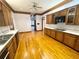 Bright kitchen with hardwood floors, ample cabinetry, and stainless steel appliances at 10995 Parsons Rd, Johns Creek, GA 30097