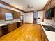 Kitchen with hardwood floors and oak cabinets at 10995 Parsons Rd, Johns Creek, GA 30097