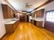 Kitchen with oak cabinets, hardwood floors and a view to backyard at 10995 Parsons Rd, Johns Creek, GA 30097