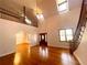 Two story foyer with hardwood floors, chandelier, and staircase at 10995 Parsons Rd, Johns Creek, GA 30097