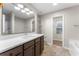 Bathroom boasts a large vanity with quartz countertop and a walk-in shower at 217 Overland Trl, Sharpsburg, GA 30277