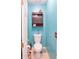 Small bathroom with toilet and brown storage cabinet at 3756 Harvest Dr, Atlanta, GA 30034