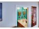 Small teal bathroom with double vanity and framed artwork at 3756 Harvest Dr, Atlanta, GA 30034