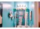 Small teal bathroom with decorative roses and framed art at 3756 Harvest Dr, Atlanta, GA 30034