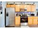 Kitchen with stainless steel appliances and light wood cabinets at 3756 Harvest Dr, Atlanta, GA 30034