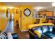 Living room features yellow walls, hardwood floors, and leather furniture at 3756 Harvest Dr, Atlanta, GA 30034