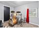 Spare bedroom featuring a drum set, a window for natural light, and carpeted floors at 204 Morris St, Palmetto, GA 30268
