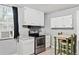 Bright kitchen featuring stainless steel appliances and plenty of cabinet space at 204 Morris St, Palmetto, GA 30268