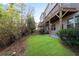 A lush, green backyard with a black fence and multiple decks above at 4139 Torver Ln, Atlanta, GA 30341