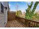Side angle of wooden deck with railing, next to the house, featuring lush green trees at 4139 Torver Ln, Atlanta, GA 30341