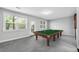 Bright game room with a pool table, light gray walls, and neutral carpet at 4139 Torver Ln, Atlanta, GA 30341