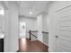 Second floor hallway features hardwood floors, wood railing, and access to the bedrooms at 4139 Torver Ln, Atlanta, GA 30341