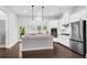 Bright open kitchen featuring granite countertops, stainless steel appliances, and island at 4139 Torver Ln, Atlanta, GA 30341
