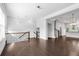 Bright living room with hardwood floors, staircase, and an open layout with a view into the kitchen at 4139 Torver Ln, Atlanta, GA 30341