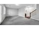 Spacious living room featuring carpet flooring, neutral walls, and lots of light at 4139 Torver Ln, Atlanta, GA 30341