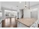 Open-concept living room features hardwood floors, fireplace, recessed lighting, and views from the kitchen at 4139 Torver Ln, Atlanta, GA 30341
