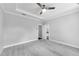 Large primary bedroom with a tray ceiling, ceiling fan, and ensuite bathroom at 4139 Torver Ln, Atlanta, GA 30341