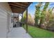 A patio overlooking a grassy yard and wooded area with a black fence at 4139 Torver Ln, Atlanta, GA 30341