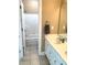 This bathroom features a double sink vanity with white cabinetry and a shower-tub combination at 517 Mary Margaret Walk, Loganville, GA 30052