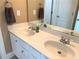 Bathroom featuring double sinks and a large mirror at 517 Mary Margaret Walk, Loganville, GA 30052