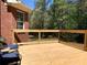 Wooden deck with black metal railings, perfect for outdoor relaxation and enjoying nature at 517 Mary Margaret Walk, Loganville, GA 30052