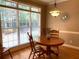 Cozy breakfast nook featuring natural light and hardwood floors at 517 Mary Margaret Walk, Loganville, GA 30052