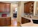 Well-lit kitchen featuring custom wood cabinets and a view into the dining room at 517 Mary Margaret Walk, Loganville, GA 30052