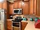 Updated kitchen with stainless steel appliances and custom cabinets at 517 Mary Margaret Walk, Loganville, GA 30052