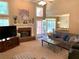 Open-concept living room showcases a brick fireplace, high ceilings, and comfortable seating for Gathering and guests at 517 Mary Margaret Walk, Loganville, GA 30052