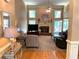 Spacious living room features a brick fireplace, plush carpeting, and ample natural light from multiple windows at 517 Mary Margaret Walk, Loganville, GA 30052