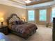 Spacious main bedroom featuring large windows and a tray ceiling at 517 Mary Margaret Walk, Loganville, GA 30052