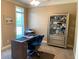 Cozy home office features a desk, comfortable chair, and display cabinet, creating a productive workspace at 517 Mary Margaret Walk, Loganville, GA 30052