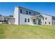 Spacious backyard with a covered patio and grassy area at 722 Crossroad Ct, Powder Springs, GA 30127