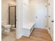 Well-lit bathroom with shower, toilet and hardwood floor at 722 Crossroad Ct, Powder Springs, GA 30127