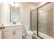 Clean bathroom with a walk-in shower, toilet and vanity at 722 Crossroad Ct, Powder Springs, GA 30127