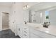 Elegant bathroom featuring a glass shower and a dual sink vanity with storage at 722 Crossroad Ct, Powder Springs, GA 30127
