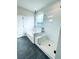 Bathroom features a soaker tub and glass-enclosed shower, providing a luxurious bathing experience at 722 Crossroad Ct, Powder Springs, GA 30127