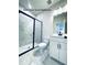 Sleek bathroom features marble tile shower, modern fixtures, and a stylish vanity at 722 Crossroad Ct, Powder Springs, GA 30127