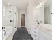 Elegant bathroom featuring a glass shower and a dual sink vanity with storage at 722 Crossroad Ct, Powder Springs, GA 30127