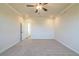 Large bedroom with ceiling fan and neutral carpeting at 722 Crossroad Ct, Powder Springs, GA 30127