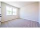 Well-lit bedroom featuring neutral walls and plush carpeting at 722 Crossroad Ct, Powder Springs, GA 30127