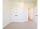 Spacious bedroom with neutral carpeting and double-door closet at 722 Crossroad Ct, Powder Springs, GA 30127