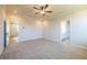 Spacious bedroom with ceiling fan and access to bathroom at 722 Crossroad Ct, Powder Springs, GA 30127