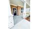Inviting front porch with stone columns and brick accents, perfect for relaxing or entertaining at 722 Crossroad Ct, Powder Springs, GA 30127