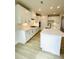Modern kitchen with white cabinets, stainless steel appliances, gas cooktop, and large island with quartz countertop at 722 Crossroad Ct, Powder Springs, GA 30127