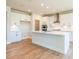 Modern kitchen with white cabinets, quartz countertops, and stainless steel appliances at 722 Crossroad Ct, Powder Springs, GA 30127