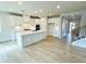 Open kitchen with large island, breakfast bar, quartz countertop, and modern appliances for cooking and entertaining at 722 Crossroad Ct, Powder Springs, GA 30127