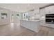 Bright kitchen features a large island, stainless steel appliances, and backyard access at 722 Crossroad Ct, Powder Springs, GA 30127